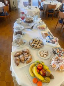 a table with many different types of food on it at Hotel Ristorante San Michele in Ome +42 photos