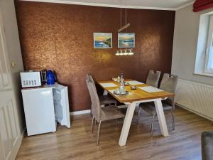a dining room with a table and chairs at Suite in Nieblum - Martina Christiansen in Nieblum