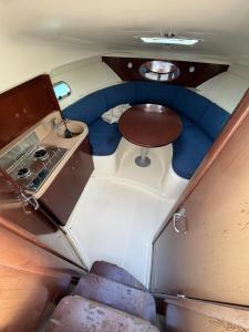 a view of the back of a boat with a stove and a table at Unique experience on a boat in Saint-Raphaël in Saint-Raphaël