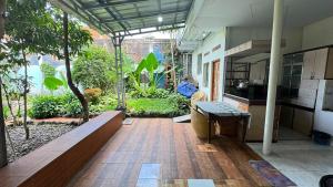 a large kitchen with a view of a garden at Pildacil in Garut