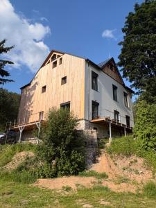 a large barn on top of a hill at Marcipánka in Jáchymov