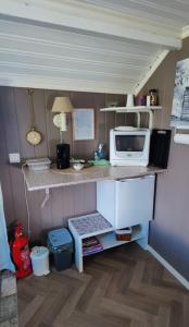 a kitchen with a counter with a microwave and a microwave at Øya husrom nær E6,dobbeltrom, gratis parkering in Sarpsborg