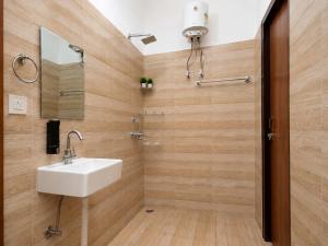 a bathroom with a sink and a mirror at Nature View Retreat in Rishīkesh +38 photos