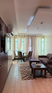 a living room with a couch and a table at فيولورين سويتس in Al Baha