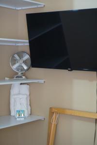 a flat screen tv hanging on a wall at Casa del Pueblo in Teotitlán del Valle +35 photos