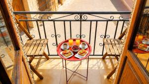 a plate of food on a table on a balcony at Casa Corzo in María