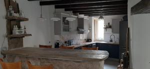 a kitchen with a large wooden counter in a room at Mulberry Tree Cottage Episkopi Paphos in Episkopi Pafou