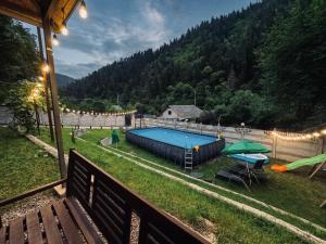a view of a swimming pool in a yard at Serenity Likani Villa Hotel in Borjomi
