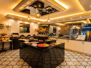 a large kitchen with a buffet of food at REAL KiNG RESiDENCE in Trabzon