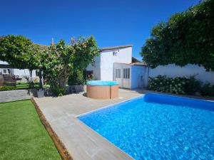 a swimming pool in the yard of a house at Lila Natur León1 Apartment 4 Pers in Villafañé