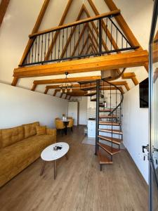 a living room with a couch and a table at Bungalows Panorama Hills in Plužine