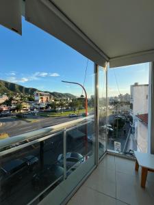 a room with a view of a city street at Carilo in Villa Carlos Paz