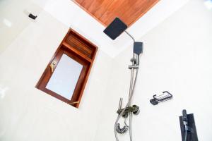 a shower in a bathroom with a window at Zenora Villa ella in Ella +90 photos