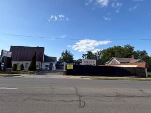 an empty street in front of a building at Riviera motel in Detroit