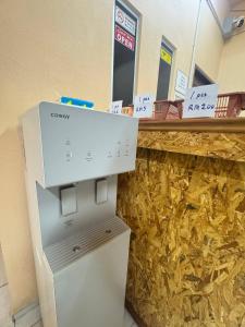 a counter in a store with a cash register at Hotel RS Inn in Rantau Panjang
