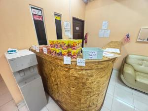 a counter in a hospital room with snacks on it at Hotel RS Inn in Rantau Panjang