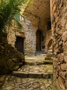 an alley way in an old stone building at La Rocca Sospesa - Castello in Apricale