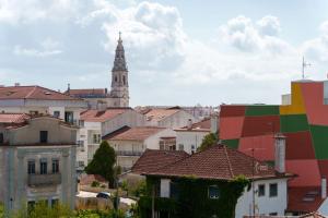 a view of a city with a clock tower at StaynFeel 04 in Fátima +35 photos