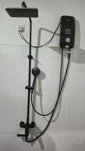 a microphone on a stand in a room at Emerald Mirror in Anuradhapura
