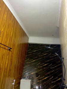 a room with a floor that has water on it at Alpha serenity in Mwanza