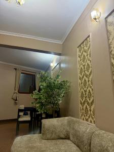 a living room with a couch and a table at Alpha serenity in Mwanza