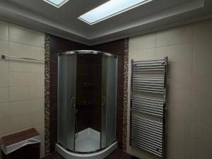a bathroom with a shower with a glass door at ''Villa Popi Gouves & Spa''Maisonette in Gouves +49 photos