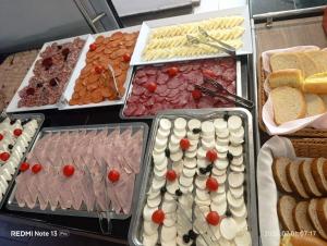 a buffet of different types of food on display at Deluxe Suites ALL Inclusive in Sunny Beach
