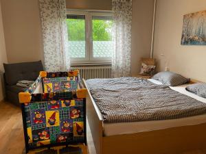 a small bedroom with a bed and a window at Am Weserradweg in Porta Westfalica