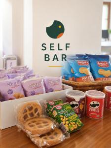 a box of self bar food and other snacks on a table at SMART Hotel Argo in Orzinuovi +20 photos