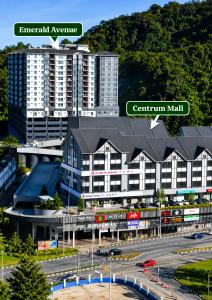 a large building with a black roof in a city at Premium Family Homestay in Cameron Highlands Clover Home 1-06 in Brinchang