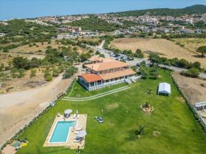 an aerial view of a house with a swimming pool at Hotel Marina in Badesi