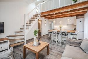 a living room with a couch and a table at Gerika guest house in Palanga