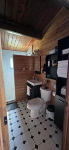 a bathroom with a toilet and a sink at Captain JaC's Hideaway in Mallorytown +34 photos