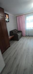 a living room with a couch and a table at Bugazik in Karolino-Buhaz