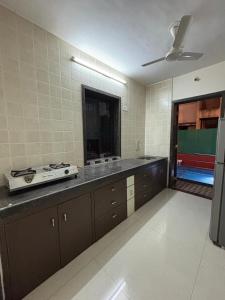 a kitchen with a sink and a counter top at Cinnamon Villa - The Dream Stays ll Pvt Pool ll 3Ac Rooms ll Wi-Fi in Khandāla