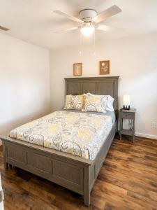 a bedroom with a bed and a ceiling fan at Cozy Tampa Home in Tampa