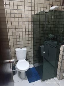 a bathroom with a toilet and a shower at Rô Hostel Cabo Branco in João Pessoa +24 photos
