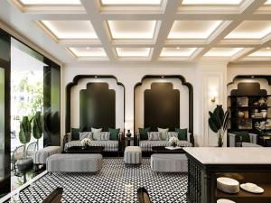a living room with a couch and a table at Grand KAS Premium Hotel & Sky Bar in Ho Chi Minh City