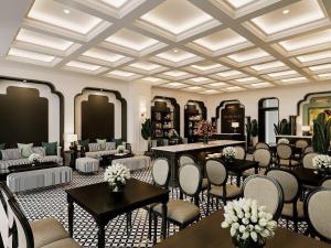 a lobby with tables and chairs and a salon at Grand KAS Premium Hotel & Sky Bar in Ho Chi Minh City