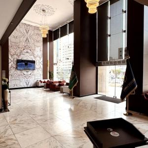 a lobby of a building with couches and a lobby at Park Elite Hotel - فندق بارك إيليت in Mecca