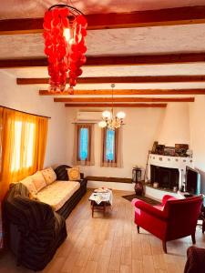 a living room with a couch and a fireplace at Nancy in Politika