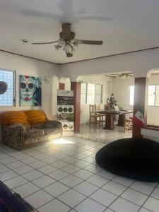 a living room with a couch and a table at Hostel Treebu in Valladolid