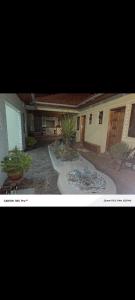 a picture of a house with a courtyard with plants at Lions adventure in Narok