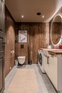 a bathroom with a sink and a washing machine at Stort hus med jaquzzi in Geilo +48 photos