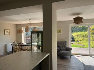 a kitchen and dining room with a table and chairs at Spacious home in Machrihanish in Machrihanish