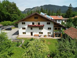 an aerial view of a house with flowers on a balcony at Haus Wörle- Ferienwohnung "Hahle" in Musau