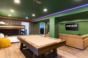 a room with a pool table and a bed at 5BR Hocking Hills Cabin, Arcade, Forest Views in South Bloomingville