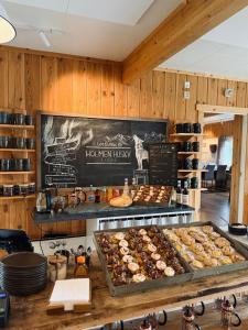a bakery with many different types of pastries on display at Holmen Husky Lodge in Alta +42 photos