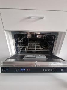 a toaster oven with its door open with food inside at Moon Love in Pakopi