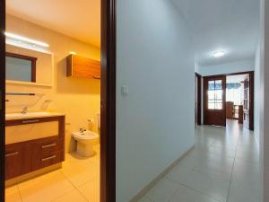 a bathroom with a sink and a toilet in it at Gran Paraíso Raxo in Raxó +12 photos